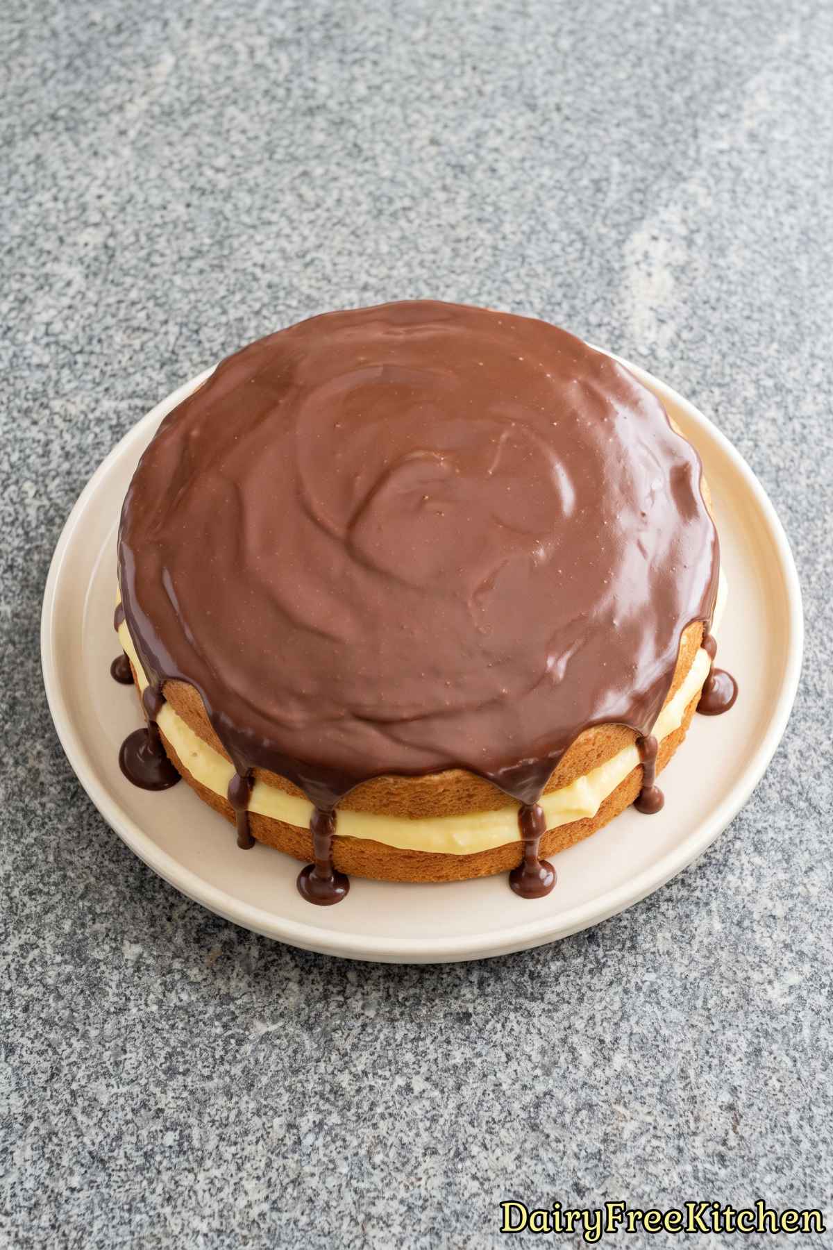 Decadent dairy free Boston cream pie slice
