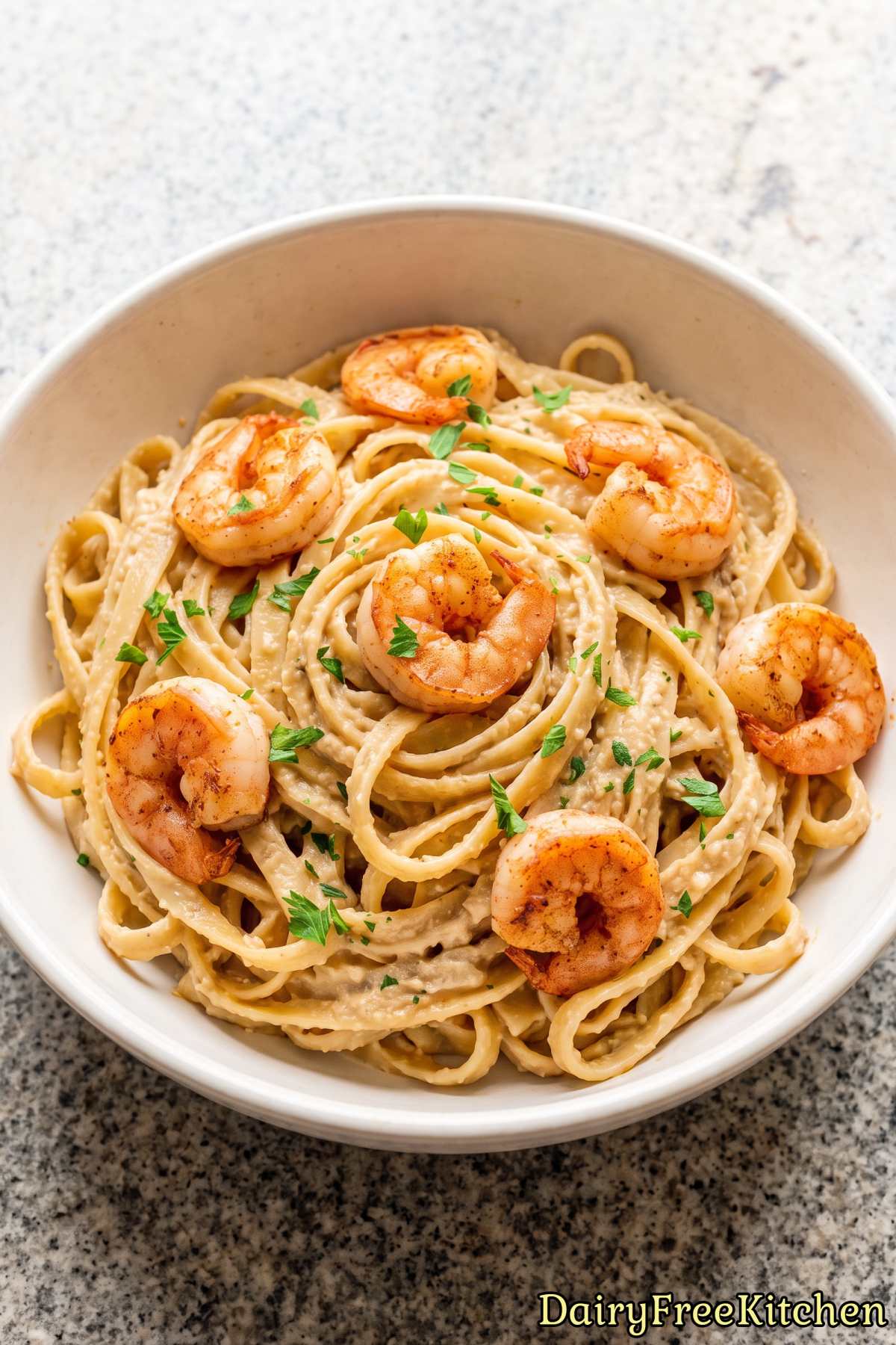 Rich dairy free alfredo pasta with Cajun shrimp.