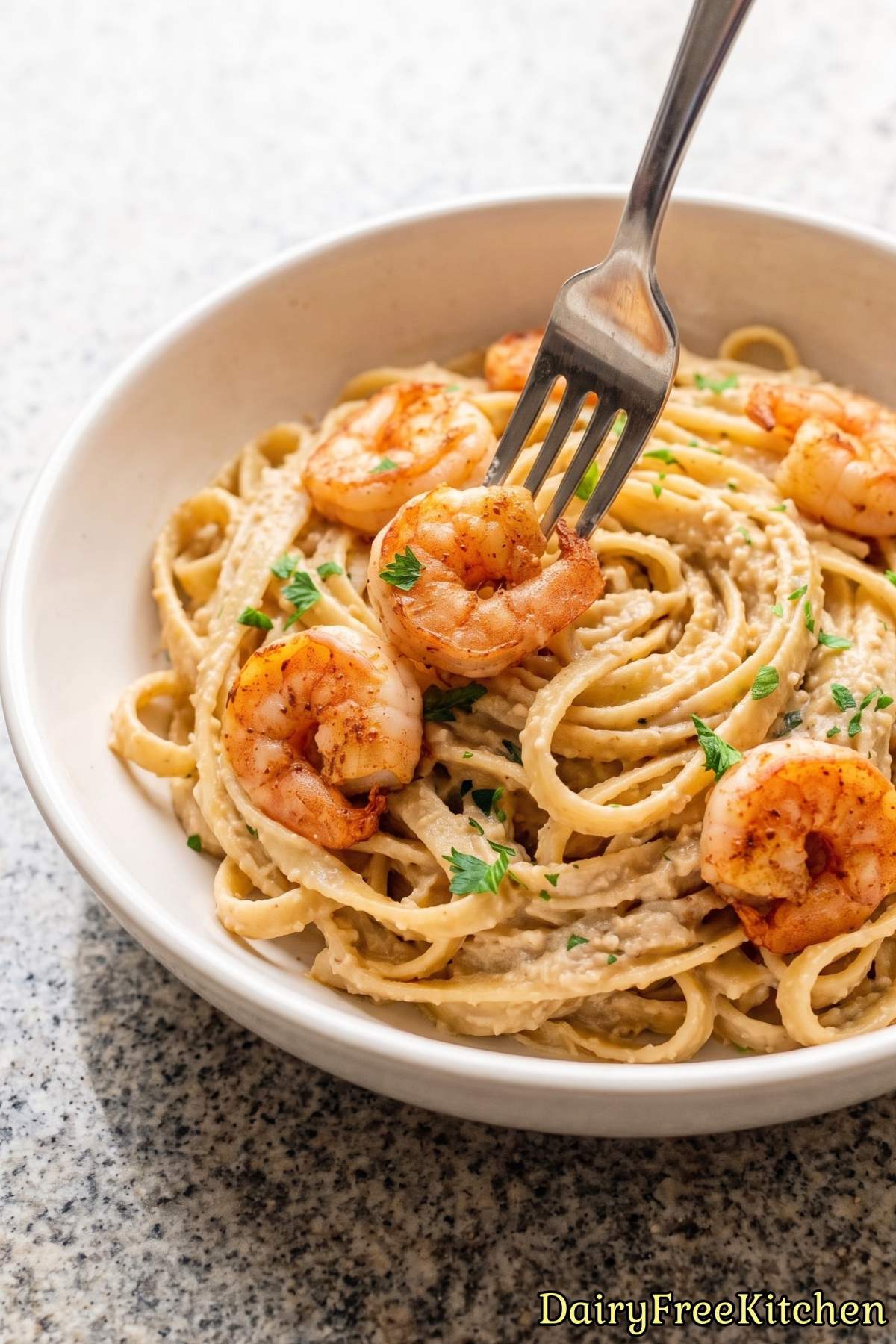 Creamy dairy free Cajun shrimp alfredo pasta.