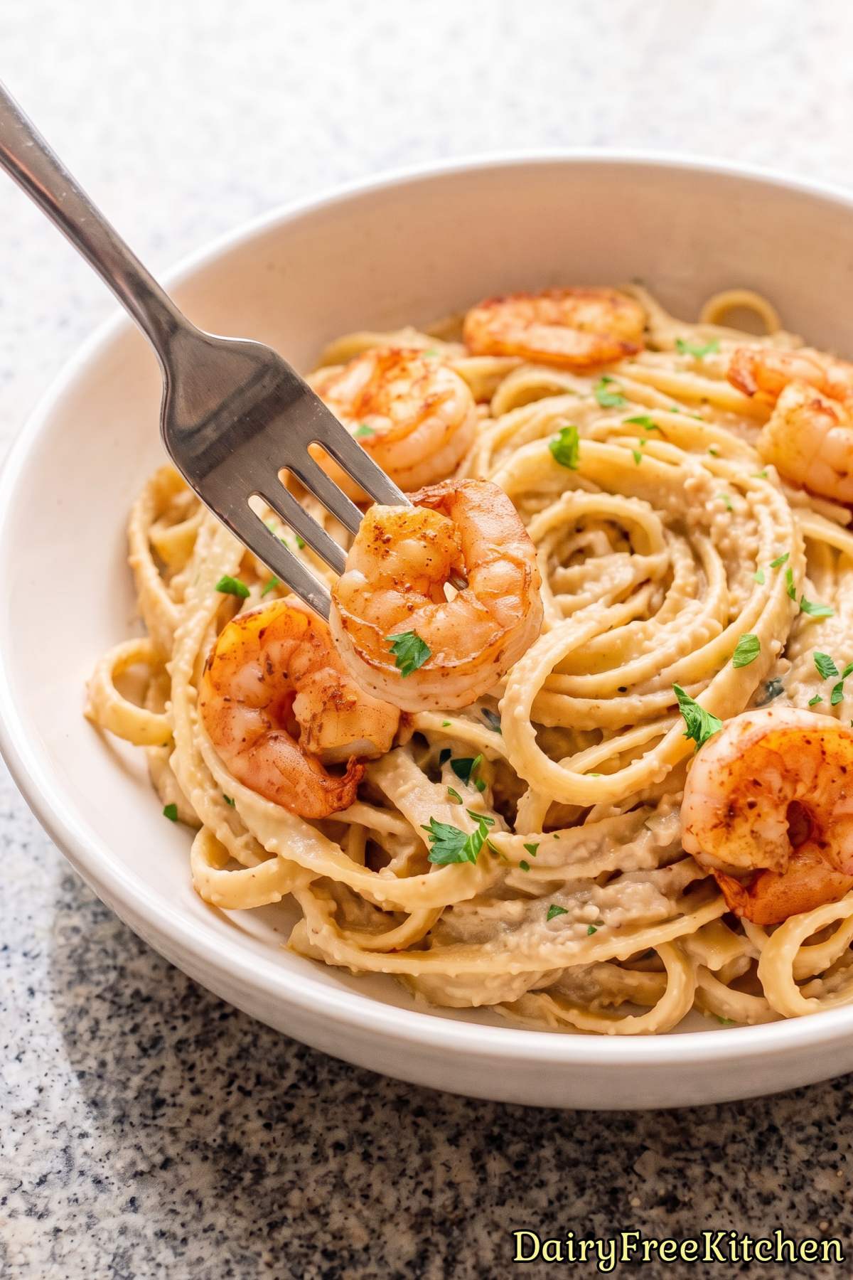 Tender Cajun shrimp over dairy free alfredo.