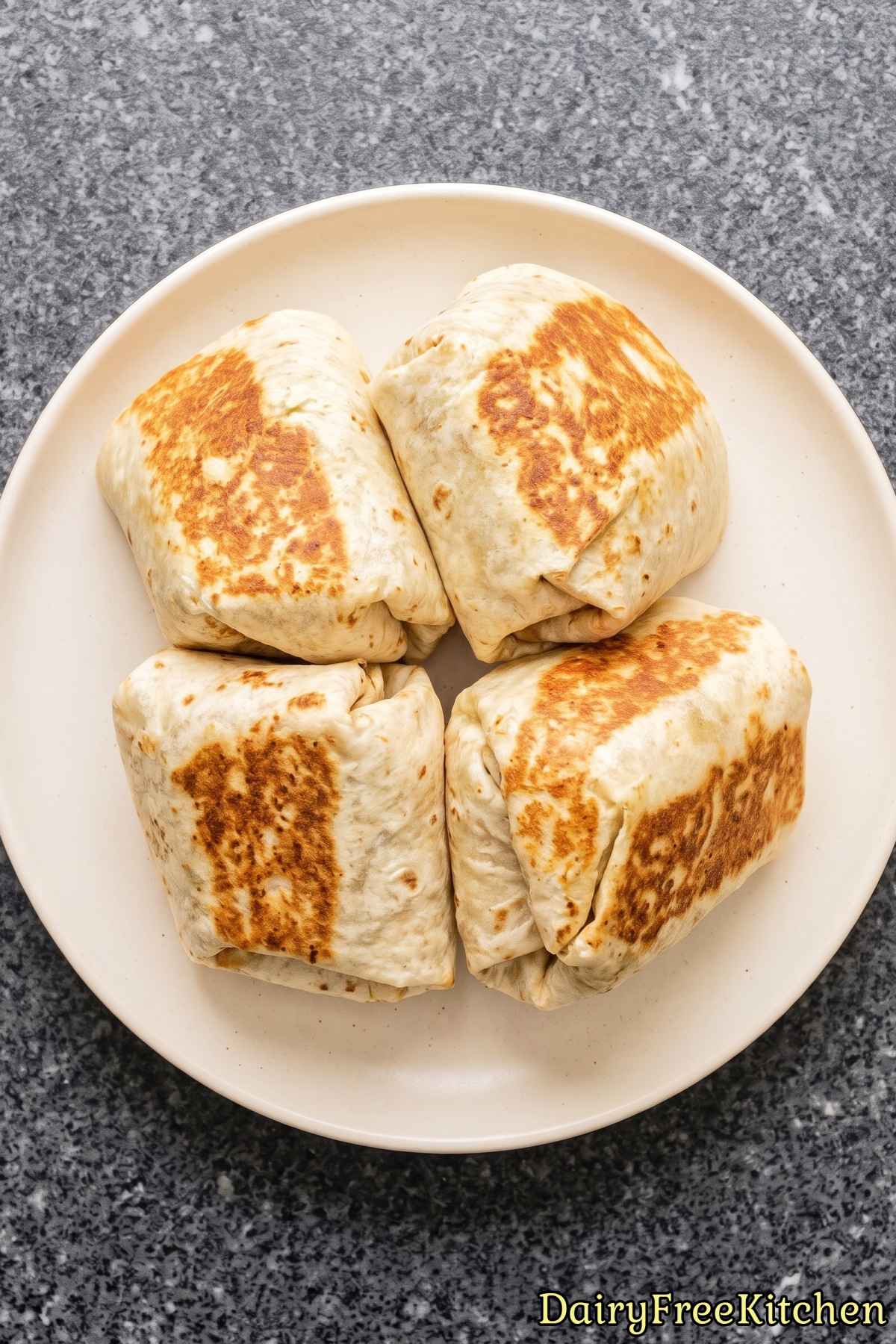 Dairy free chicken caesar wrap sliced in half