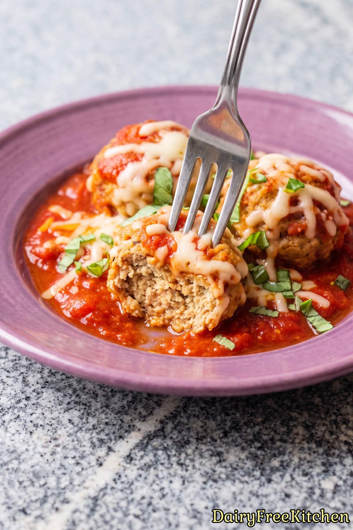 Fresh baked dairy free chicken parm meatballs.