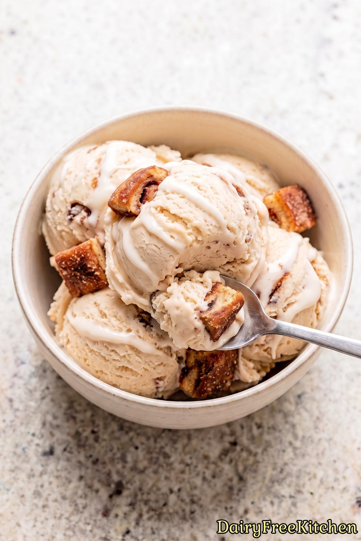 Creamy vegan cinnamon bun ice cream scoop