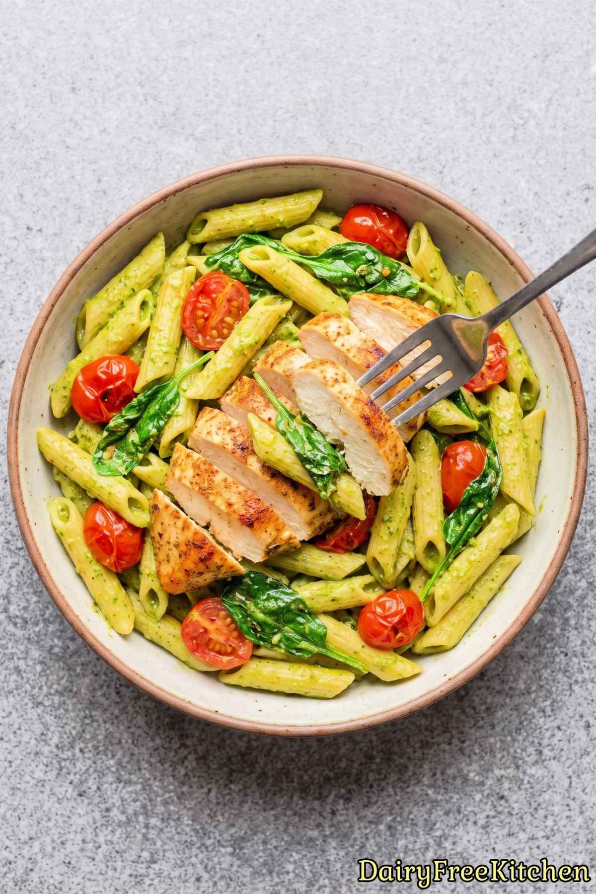 Savory bowl of dairy free chicken pesto pasta