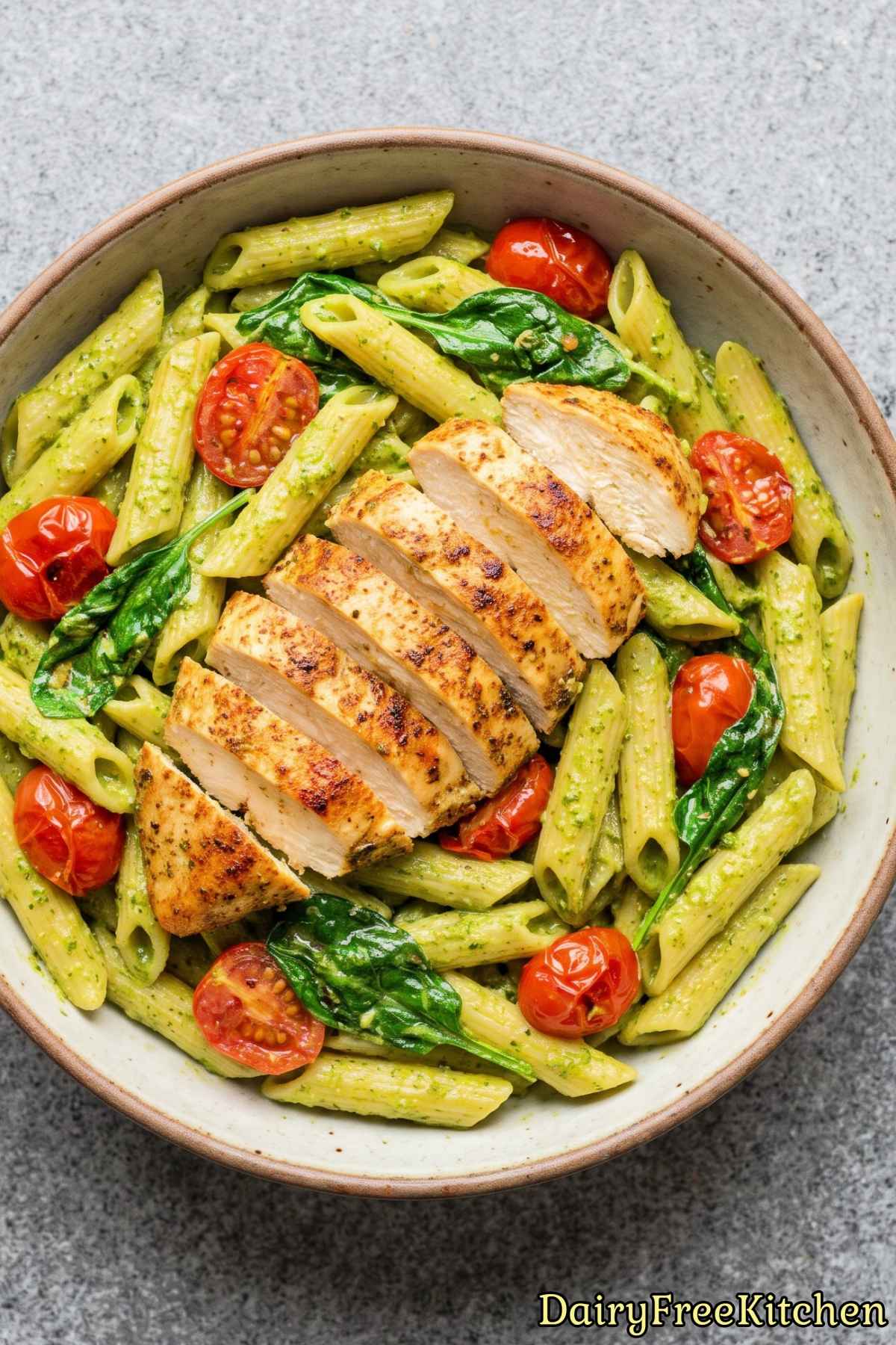 Warm dairy free chicken pasta in green pesto