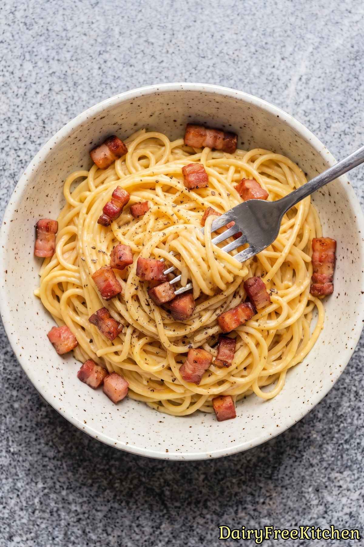 Dairy free pasta topped with crispy pancetta