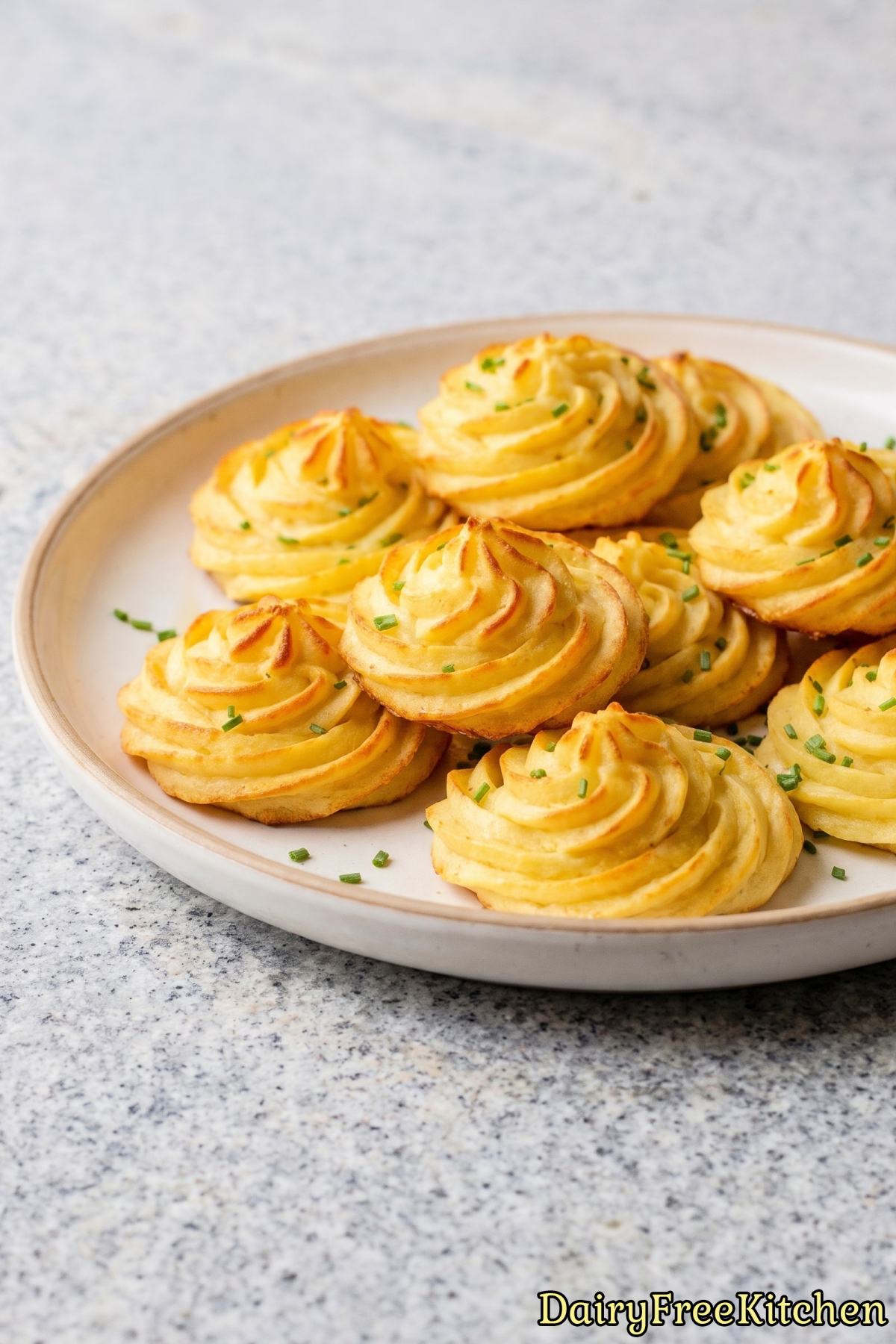 Warm dairy free duchess potatoes on a plate