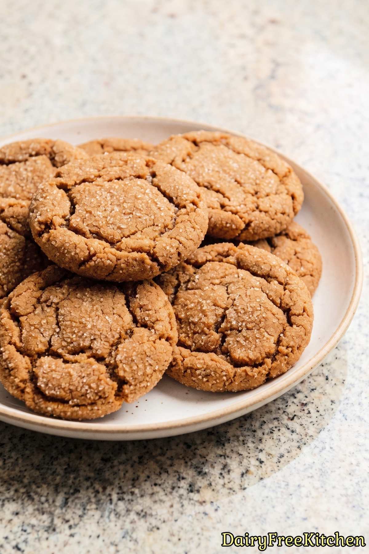 Cracked dairy free ginger cookies on a tray