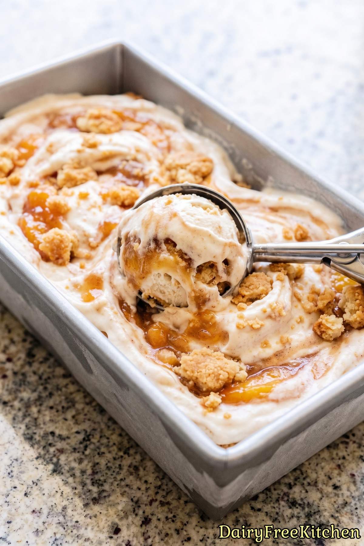 Scoop of plant based peach cobbler treat