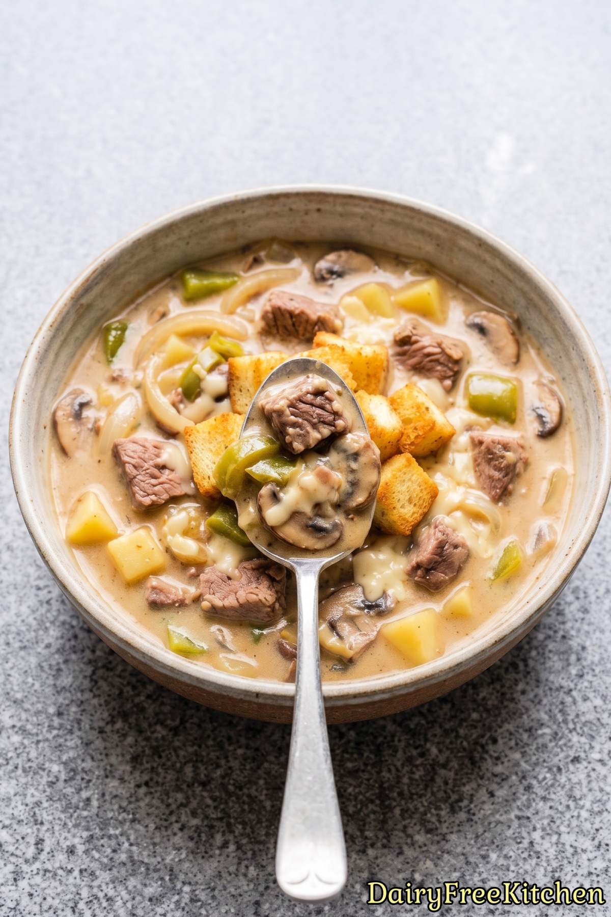 Bowl of dairy free Philly cheesesteak soup