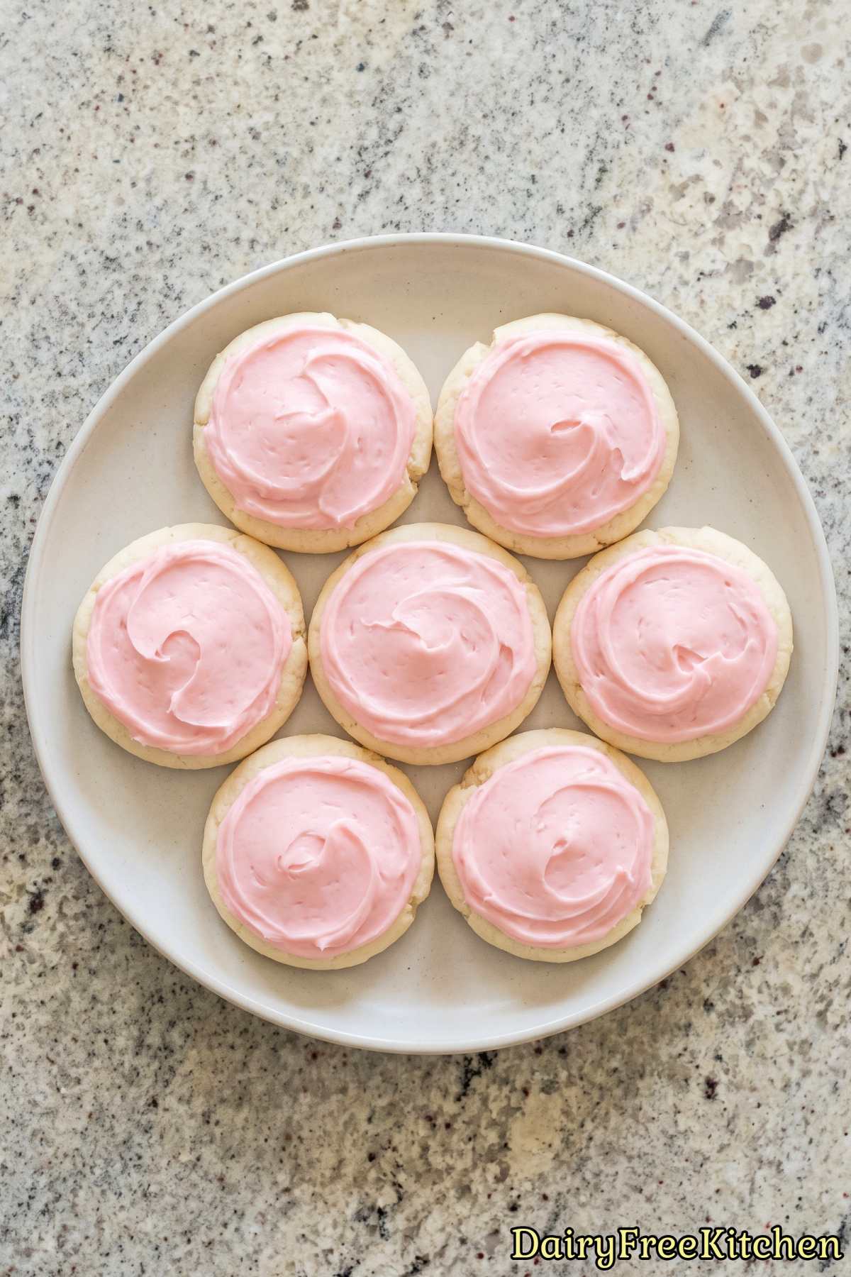 Baked dairy free cookies with pink frosting