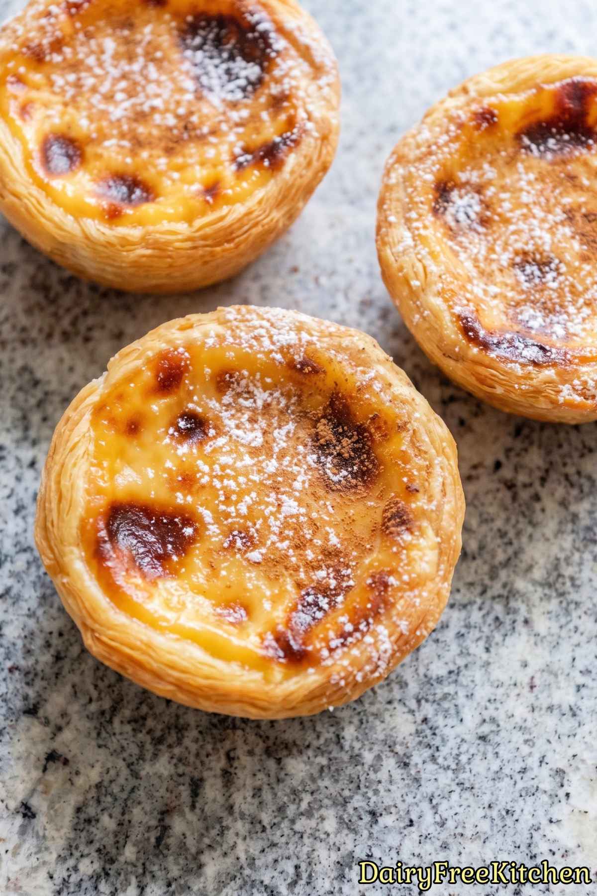 Dairy free Portuguese custard tarts on a tray