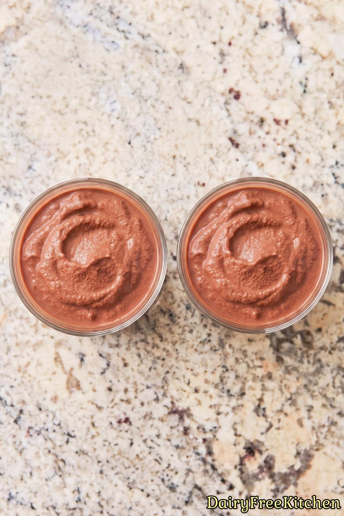 Dairy free protein chocolate frosty in a glass