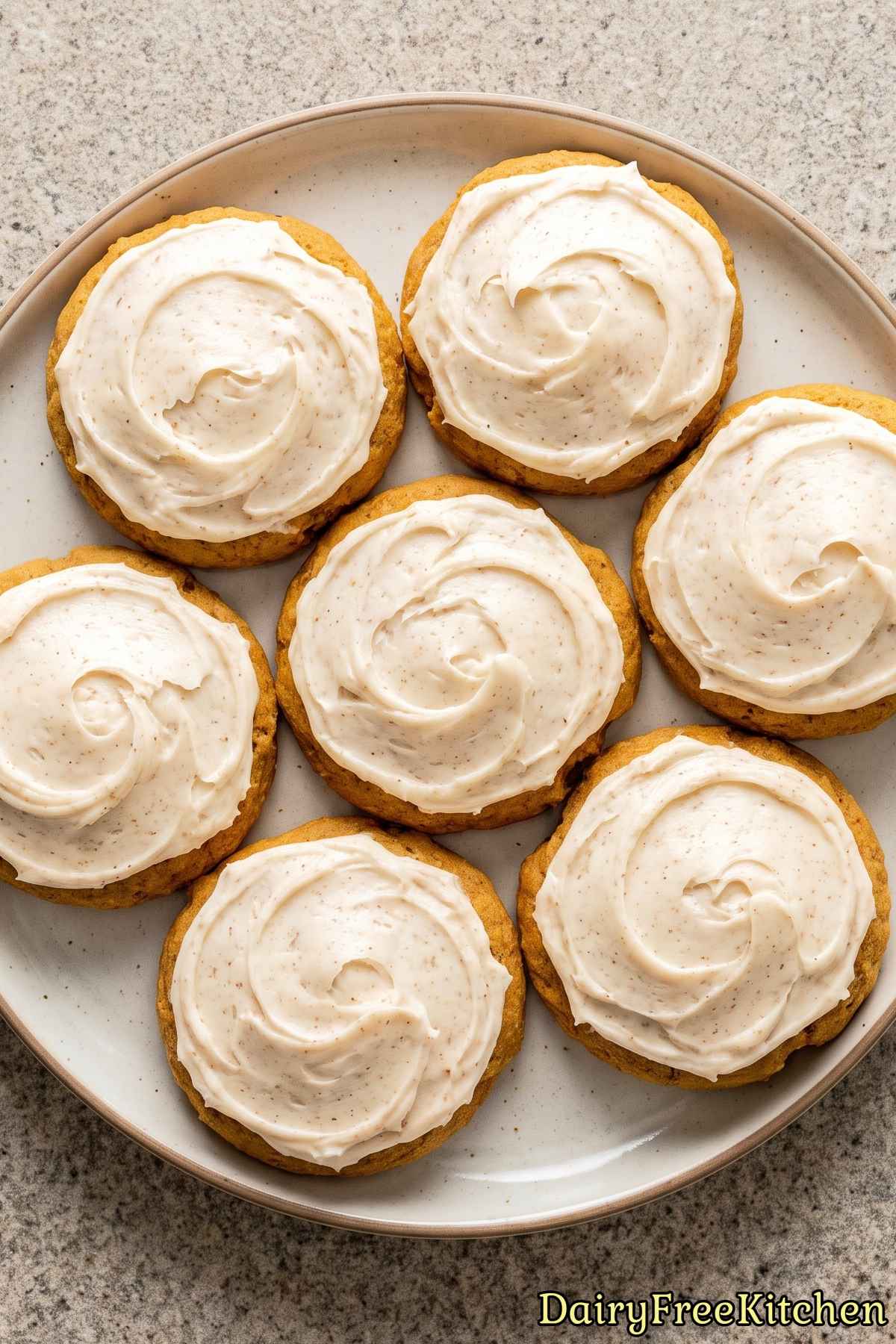 Plated dairy free pumpkin cookies with icing