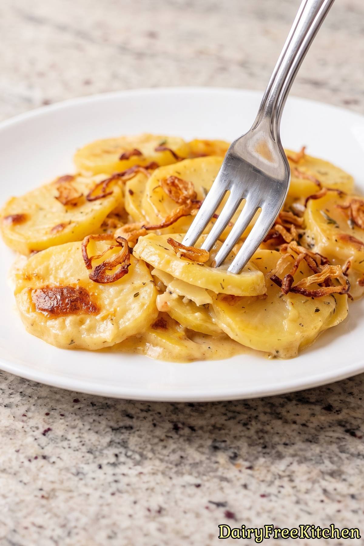 Warm scalloped potatoes with crispy shallots