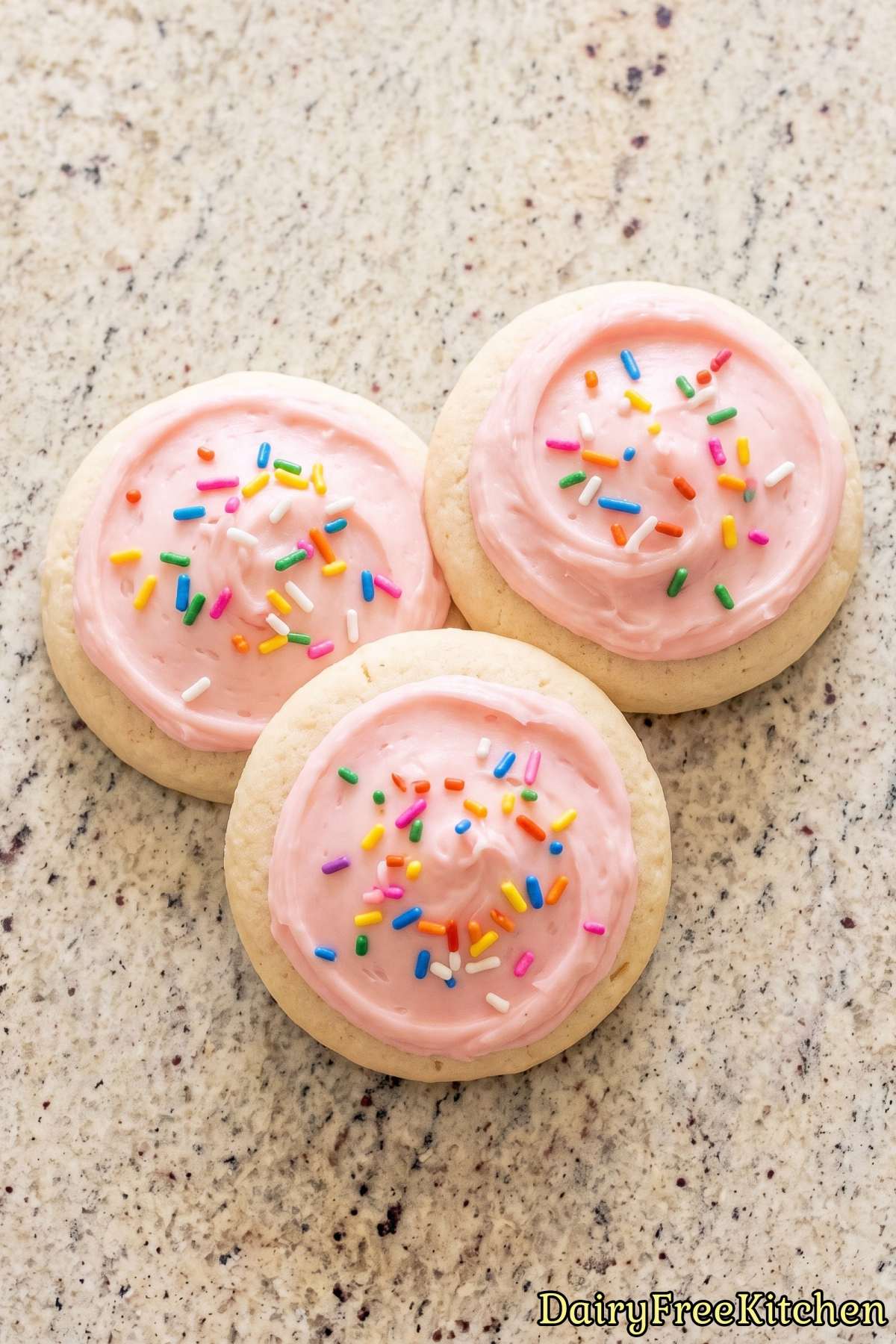 Iced dairy free sugar cookies on a plate